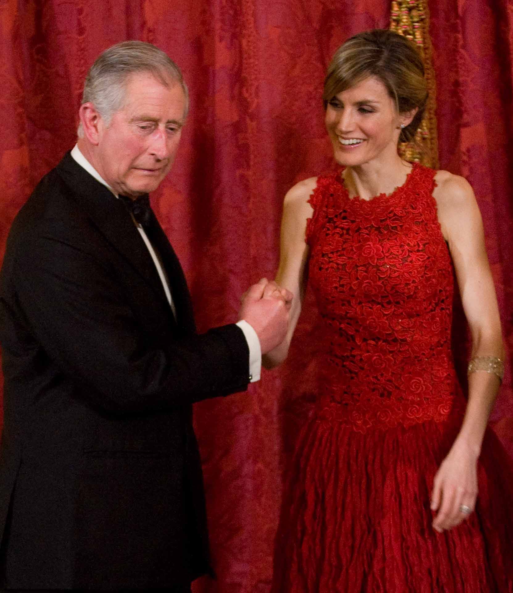 Letizia, Princess of Asturias greets Prince Charles, Prince of Wales attend the official welcome dinner given at the Royal Palace of Madrid