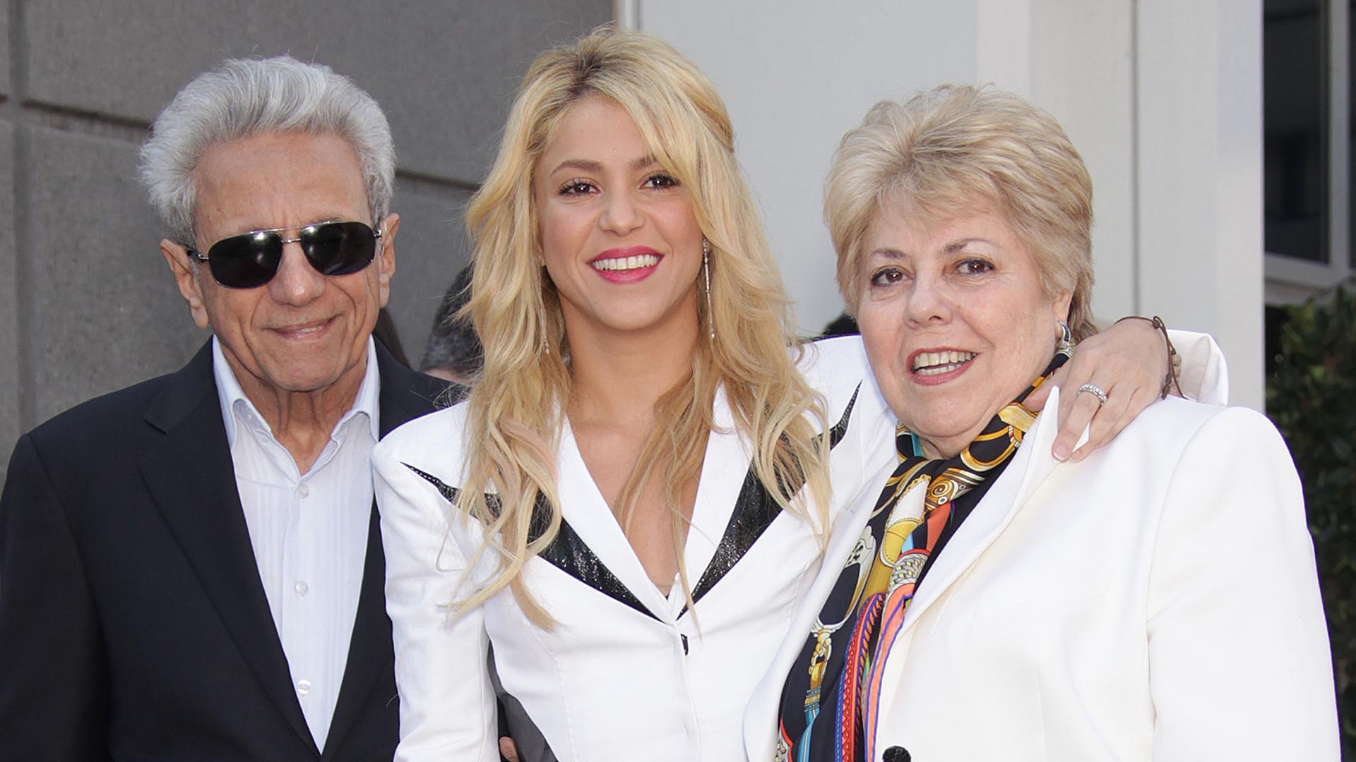 Singer Shakira (C) poses next to her star with her father William Mebarak Chadid (L) and mother Nidia del Carmen Ripoli Torrado (R) during an unveiling ceremony honoring her with the 2,454th star on the Hollywood Walk of Fame in Los Angeles on November 8, 2011.