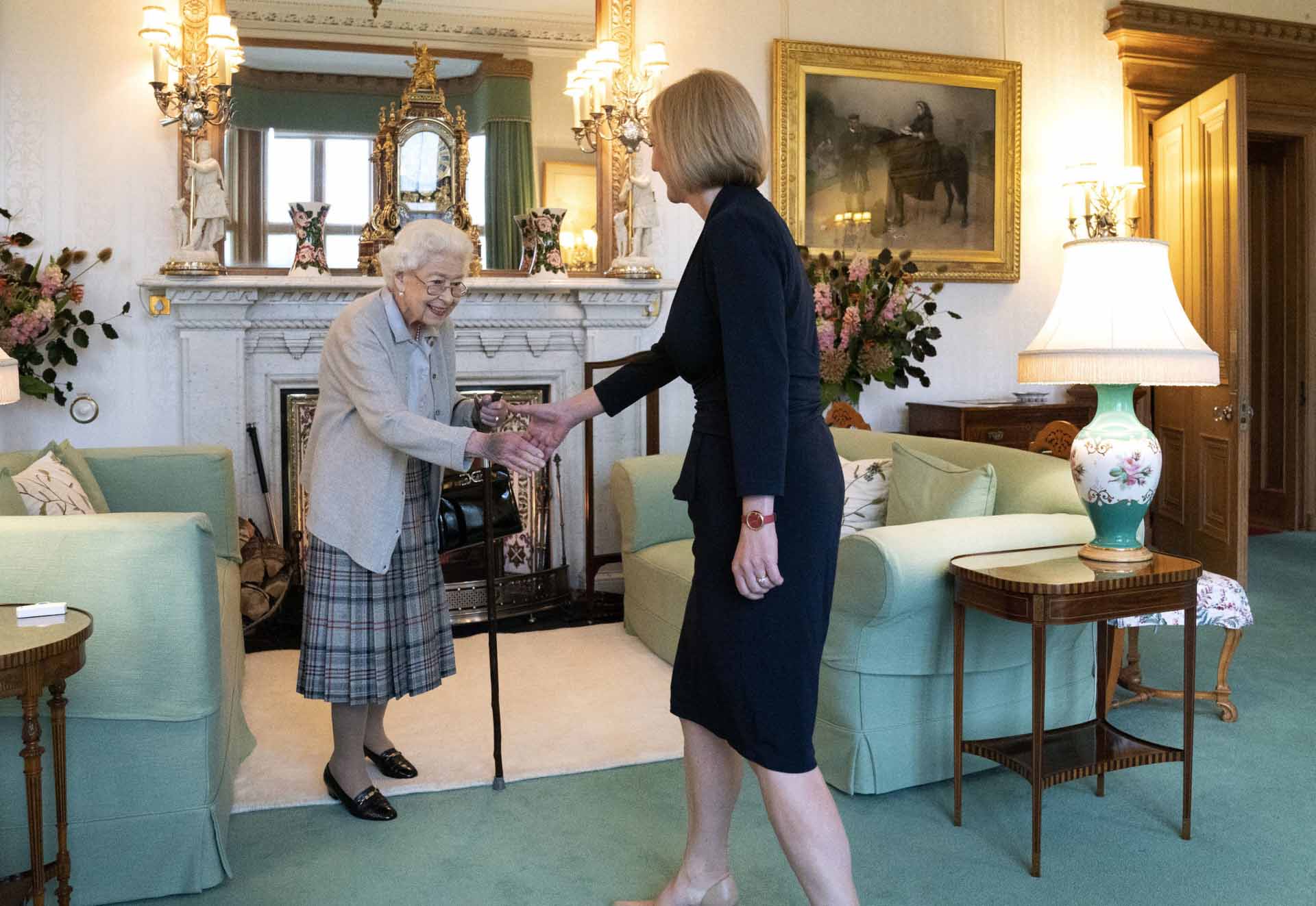 Britain’s Queen Elizabeth II, left, welcomes Liz Truss during an audience at Balmoral, Scotland, where she invited the newly elected leader of the Conservative party to become Prime Minister and form a new government, Tuesday, Sept. 6, 2022.