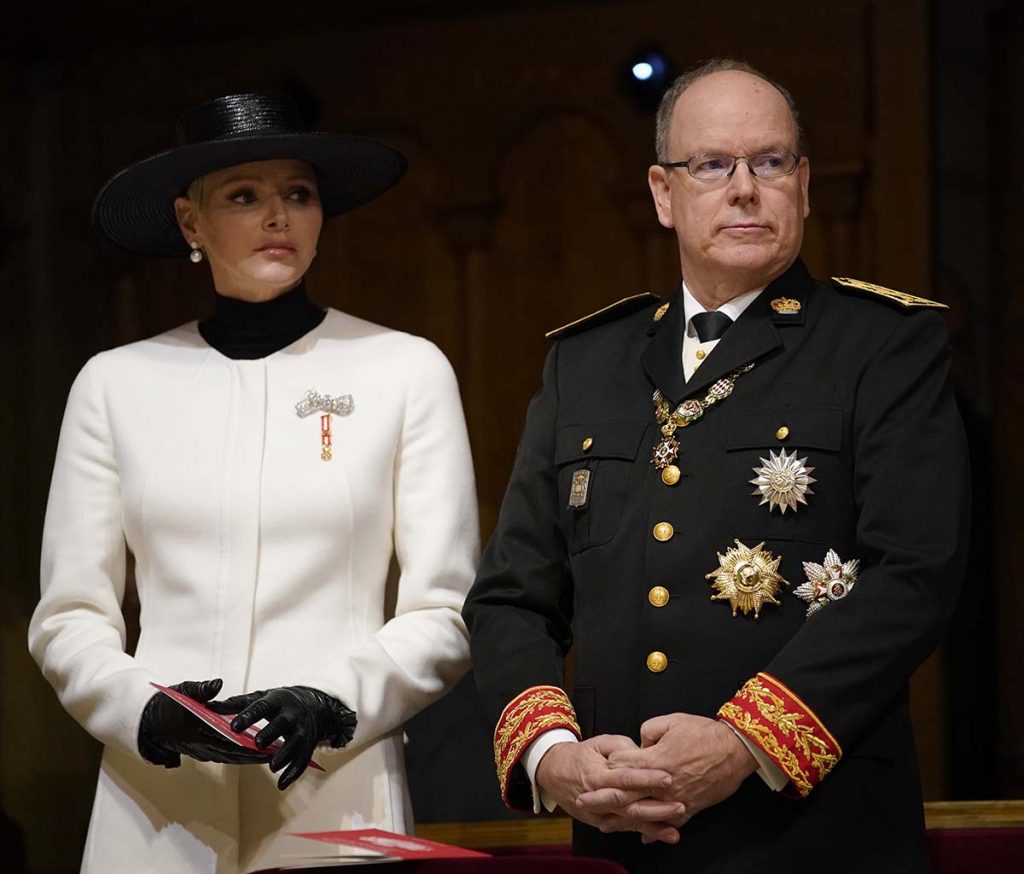 Prince Albert of Monaco, right, and Princess Charlene, left, attend a mass ceremony at the Monaco cathedral as part of ceremonies marking National Day, in Monaco, Saturday Nov.19, 2022. (AP Photo/Daniel Cole, Pool)