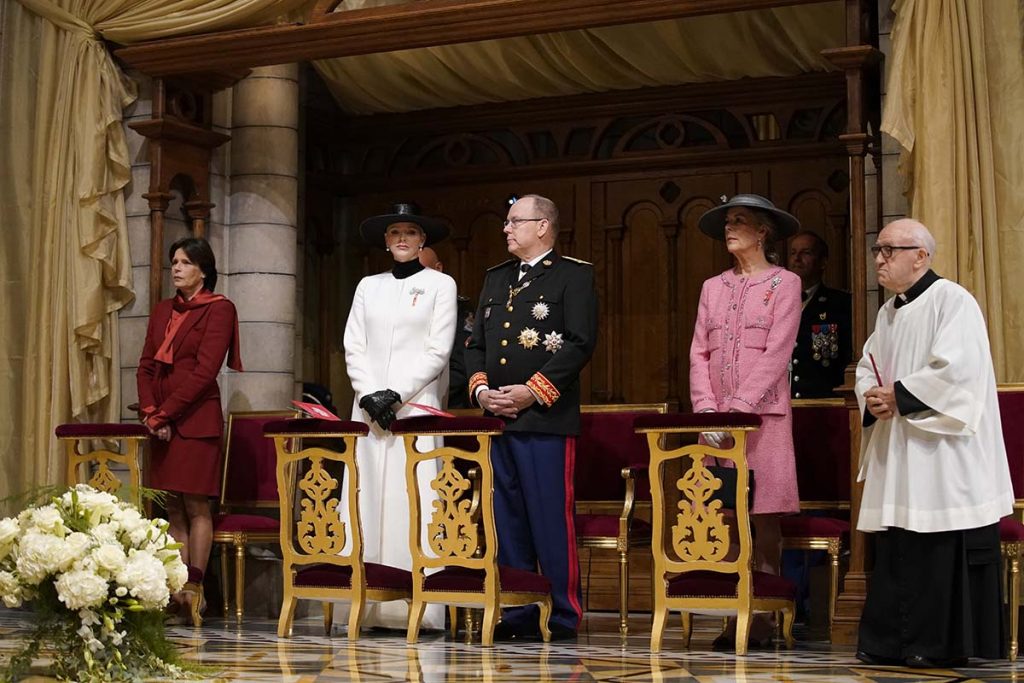 Prince Albert of Monaco, center right, and Princess Charlene, second left, with Princess Caroline of Hanover, left, and Princess Stephanie of Monaco, second right, attend a mass ceremony at the Monaco cathedral as part of ceremonies marking National Day, in Monaco, Saturday Nov.19, 2022. (AP Photo/Daniel Cole, Pool)